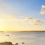 POR DO SOL NA LAGOA GUARAIRA